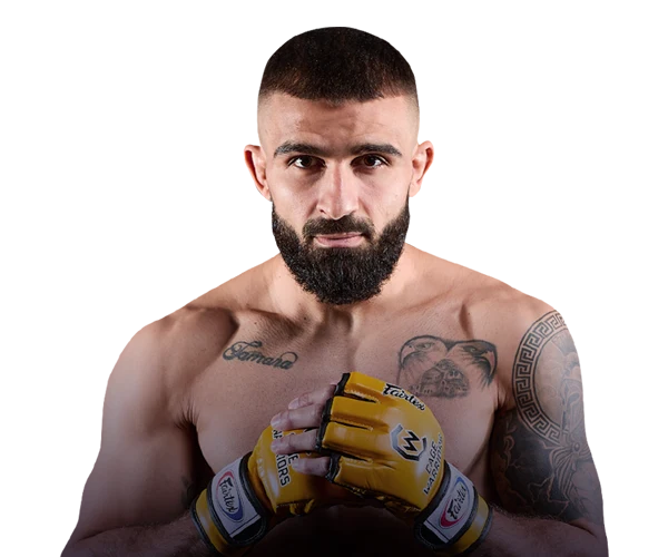 Alexis Zeus Tsarmantidis wearing the yellow Cage Warriors gloves